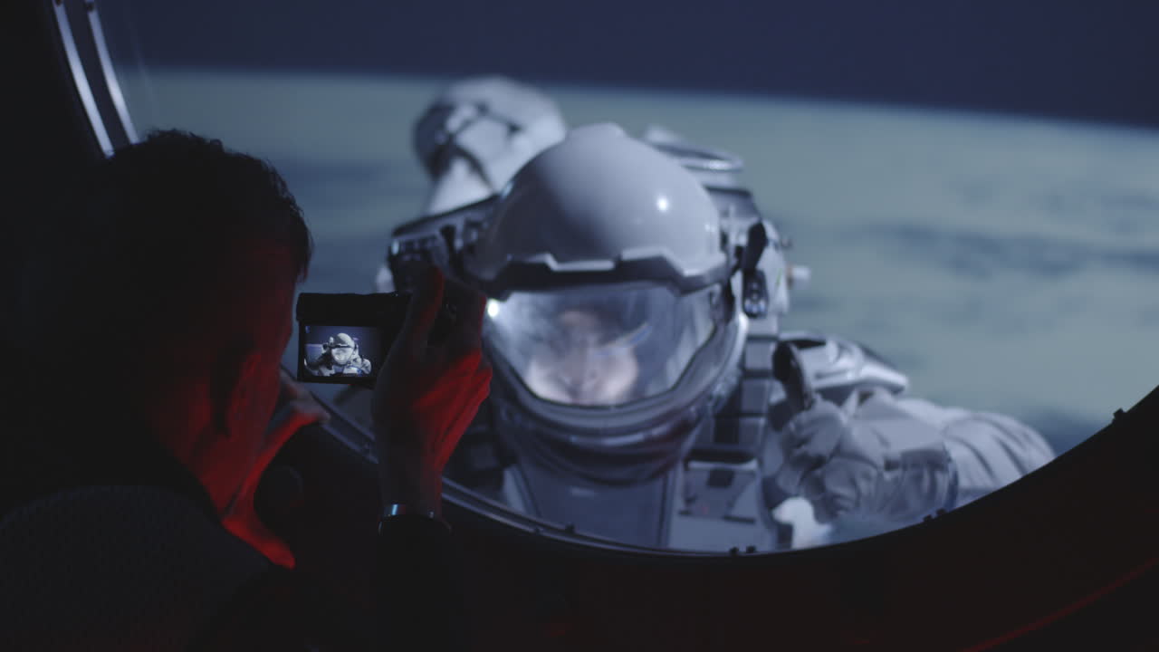 Astronaut Spacewalk Viewed Through a Spacecraft Window