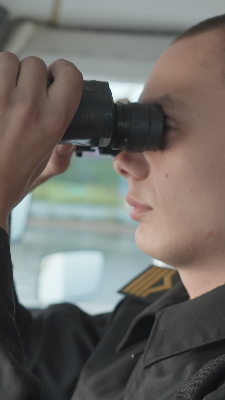 Naval Officer Using Binoculars on a Ship