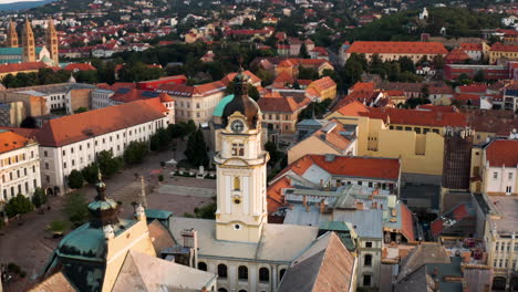 panoramic view of the szechenyi square surrounded with medieval buildings in pecs, hungary