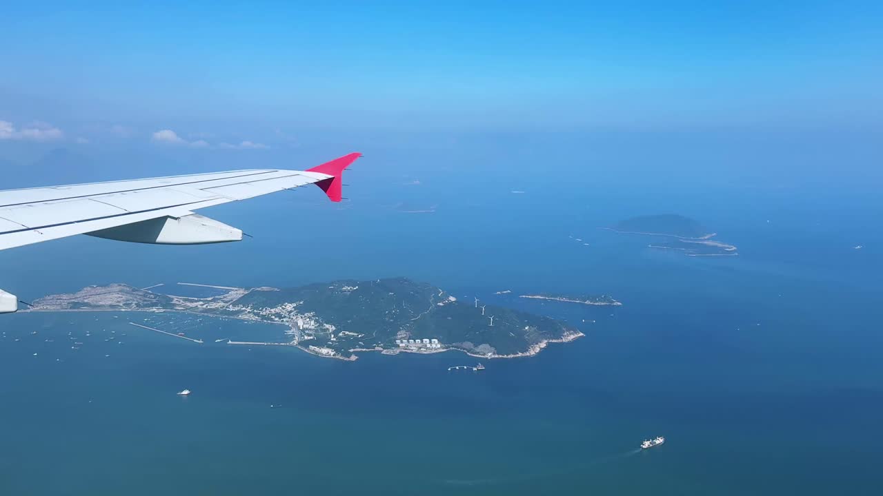Scenic aerial view of islands from airplane window during flight
