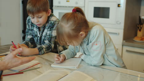 family doing homework in kitchen