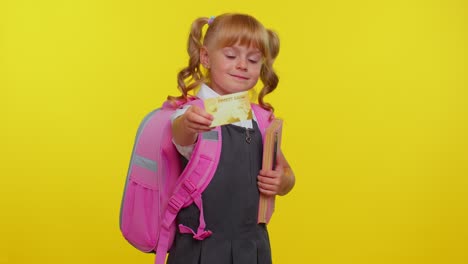 Cheerful-funny-school-girl-kid-in-uniform-hold-in-hand-bank-credit-card-showing-thumbs-up-gesture,