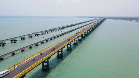 aerial drone shot showcasing rameshwaram city’s charm, with the bridge standing prominently in the distance.