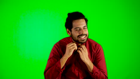 indian guy standing during hot weather with green screen - green chroma key