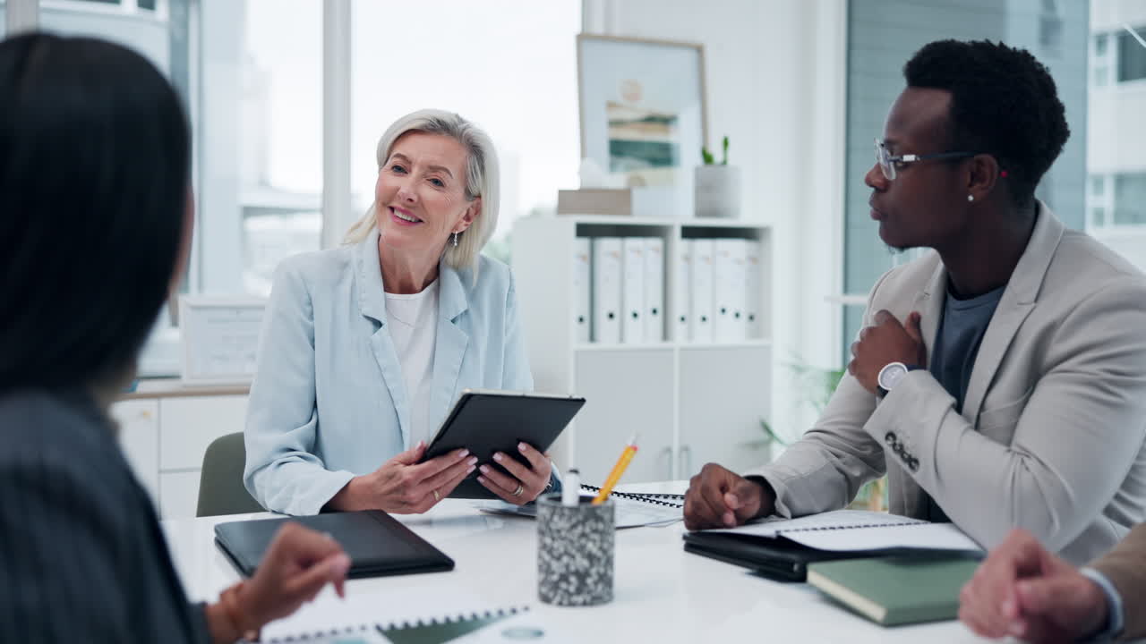 Business meeting in a modern office with diverse team members