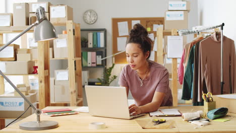 woman working from home in a small business office