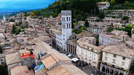 aerial view of torre del popolo and temple of minerva facing the piazza del comune in assisi, italy