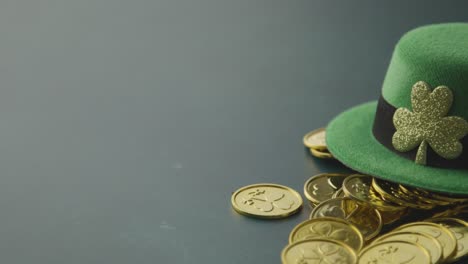 Studio-Shot-Of-Green-Leprechaun-Top-Hat-And-Piles-Of-Gold-Coins-To-Celebrate-St-Patricks-Day-2