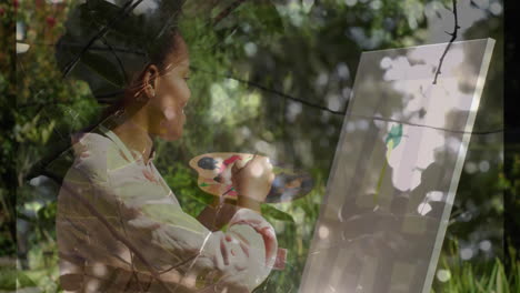 woman painting green flower shape for education, using paintbrush, animated strokes swirling canvas