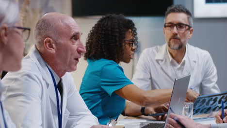 medical team reviewing x-rays in a meeting