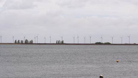 extra wide shot at wind turbines moving in the wind at covenham reservoir covenham at st bartholomew, louth