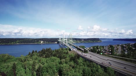Traffic-flows-smoothly-over-the-Tacoma-Narrows-Bridges,-Puget-Sound,-aerial-panorama