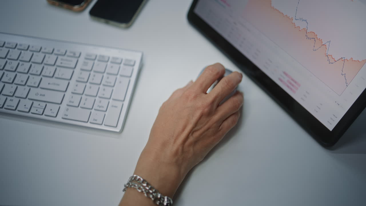 Female Financial Analyst Checking Real-Time Stocks, Exchange Market Charts in Online Trading Mobile App on Tablet Computer Using Digital Pen. Businesswoman Working in Financial Agency Office. Close Up