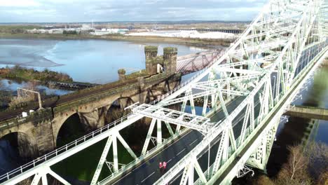 charity santa dash fun run over runcorn silver jubilee bridge aerial view dolly right tilt up