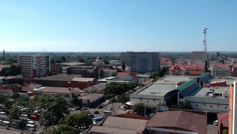 a panning drone shot of bulawayo, zimbabwe's city buildings under sunny conditions