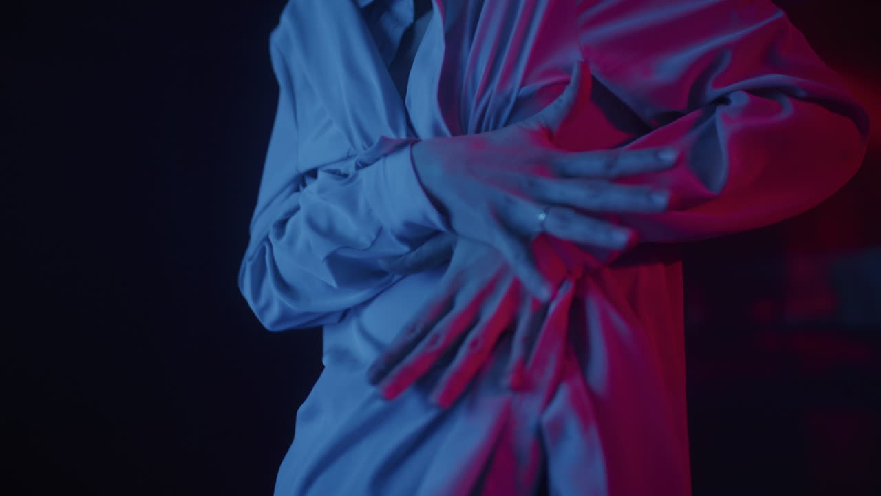 Woman in a light gray dress with neon light