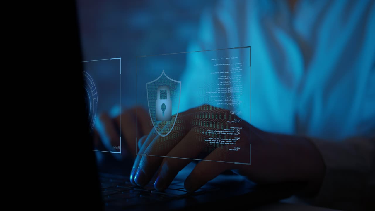 Hands Typing on Laptop with Digital Cybersecurity Interface
