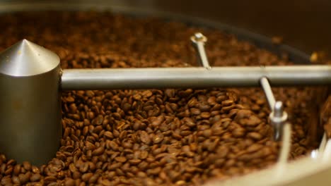 coffee beans poured inside coffee roasting machine