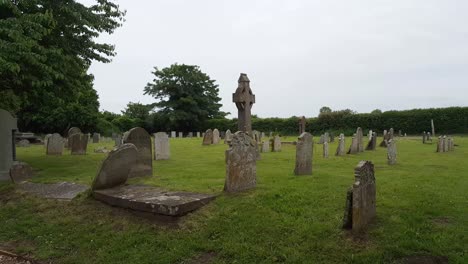 Rainy-weather-at-a-graveyard,-gloomy-weather-during-daytime-captured-near-the-grave-stones,-grieving-and-sadness-concept