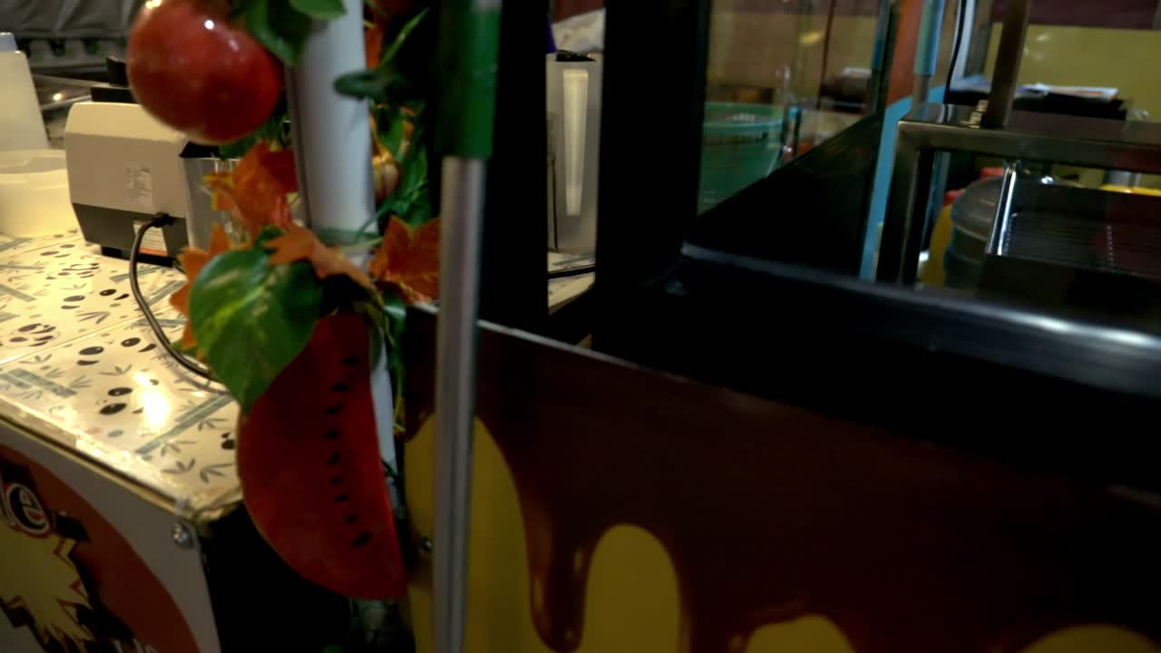 Looking at the machine at the night market in Bangkok. (Slowmotion)