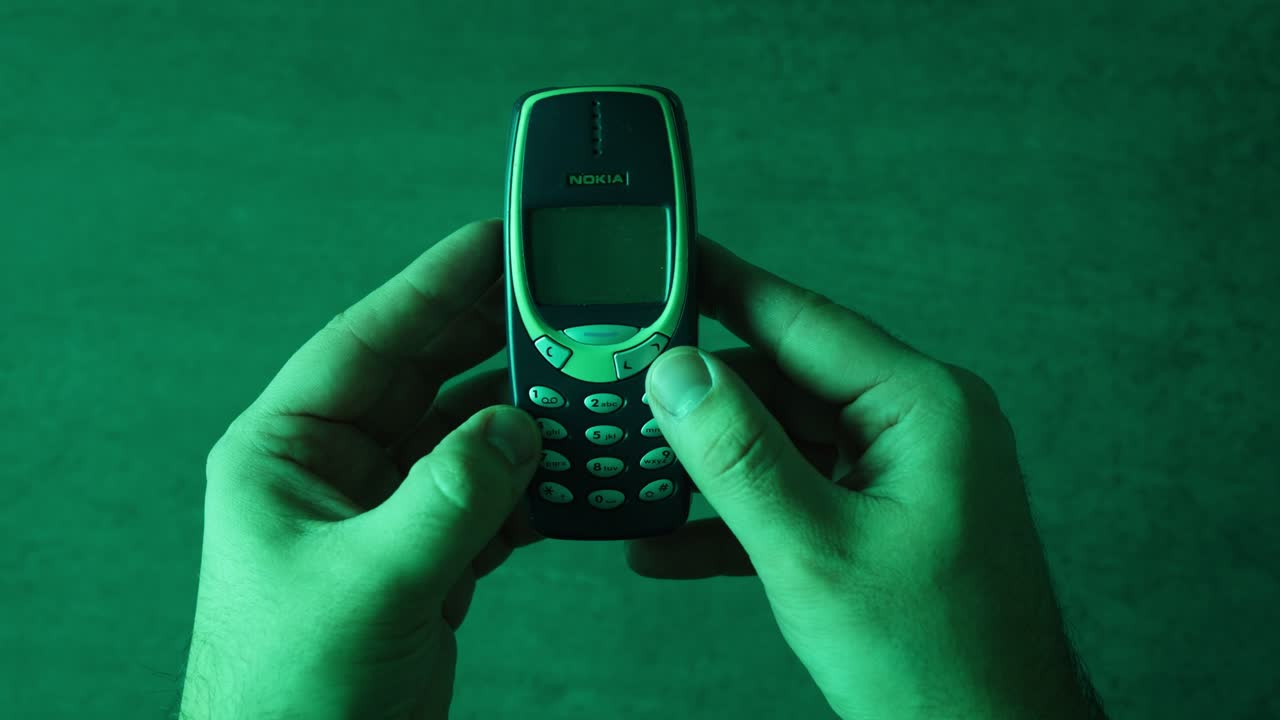 Vintage Nokia Mobile Phone in Hands