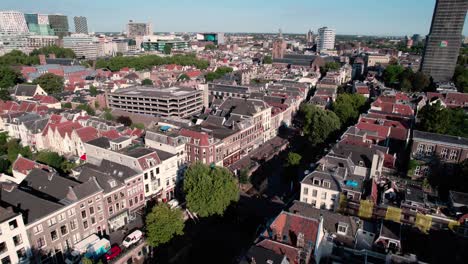 flying above utrecht netherlands historic city center, drone aerial view of buildings, streets and dom tower