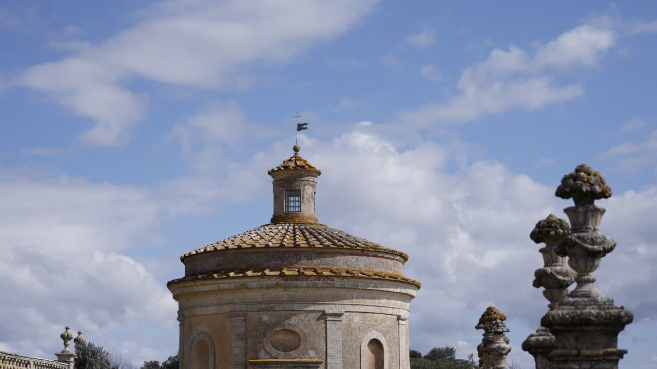 Old Stone Building with Dome under Cloudy Sky