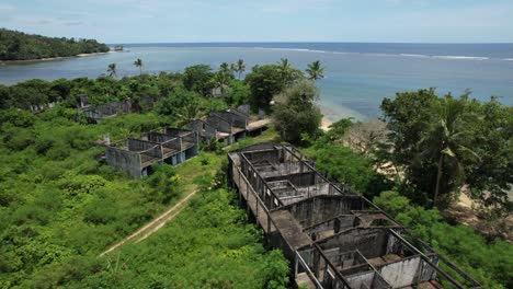 “wide aerial fly over shot of abandoned resort in tropical jungle – fiji”