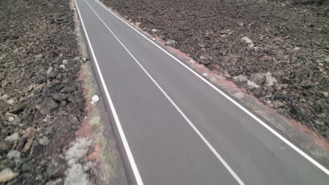 Aerial-Casacoral-Road,-near-Pueblo-Tenesar-in-Lanzarote,-Canary-Islands