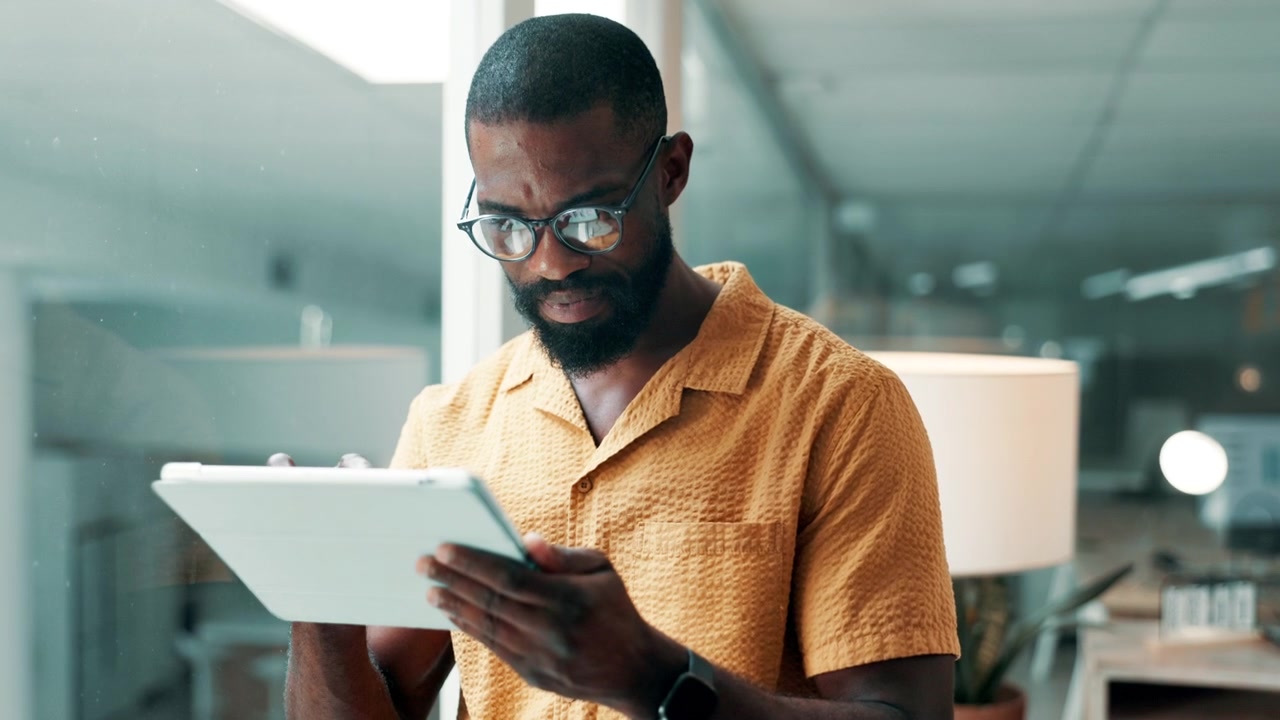 Professional Man Using Digital Tablet in Modern Office
