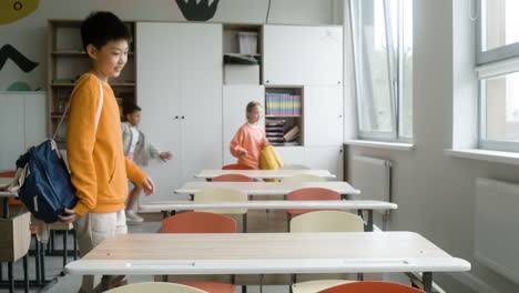 students entering classroom.