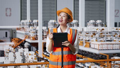 warehouse worker inspecting inventory with tablet