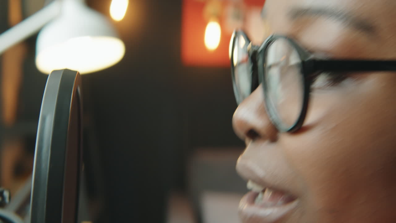 Black Woman Talking in Mic while Recording Podcast