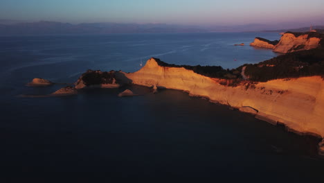 Flight-over-high-cliffs-of-sea-coast,-aerial-view