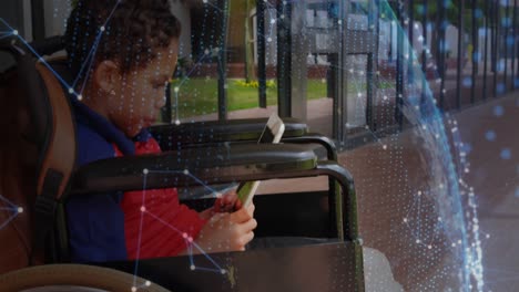 animation of network of connections over disabled african american schoolboy sitting in wheelchair