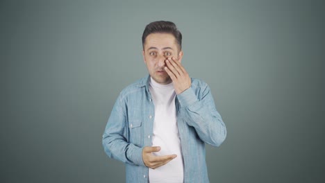 man with wrinkles and problems on his skin is unhappy.