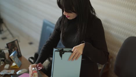 professional woman in a modern office environment, focused on work, dressed elegantly in business attire, surrounded by office equipment and a sleek interior