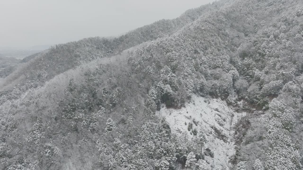 Aerial view Over Snowy Valley Houses of Yase Kyoto Japan in Winter, Mount Hiel