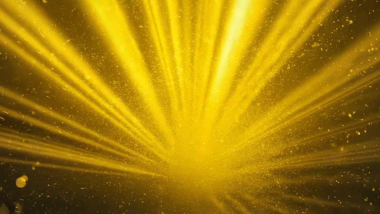 Intensifying golden core emitting radial beams on abstract backdrop, particles drifting