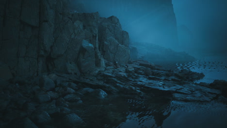 foggy coastline with rocky formations and tranquil water at dusk