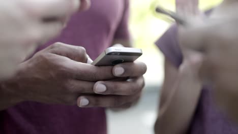 african american man typing message on smartphone