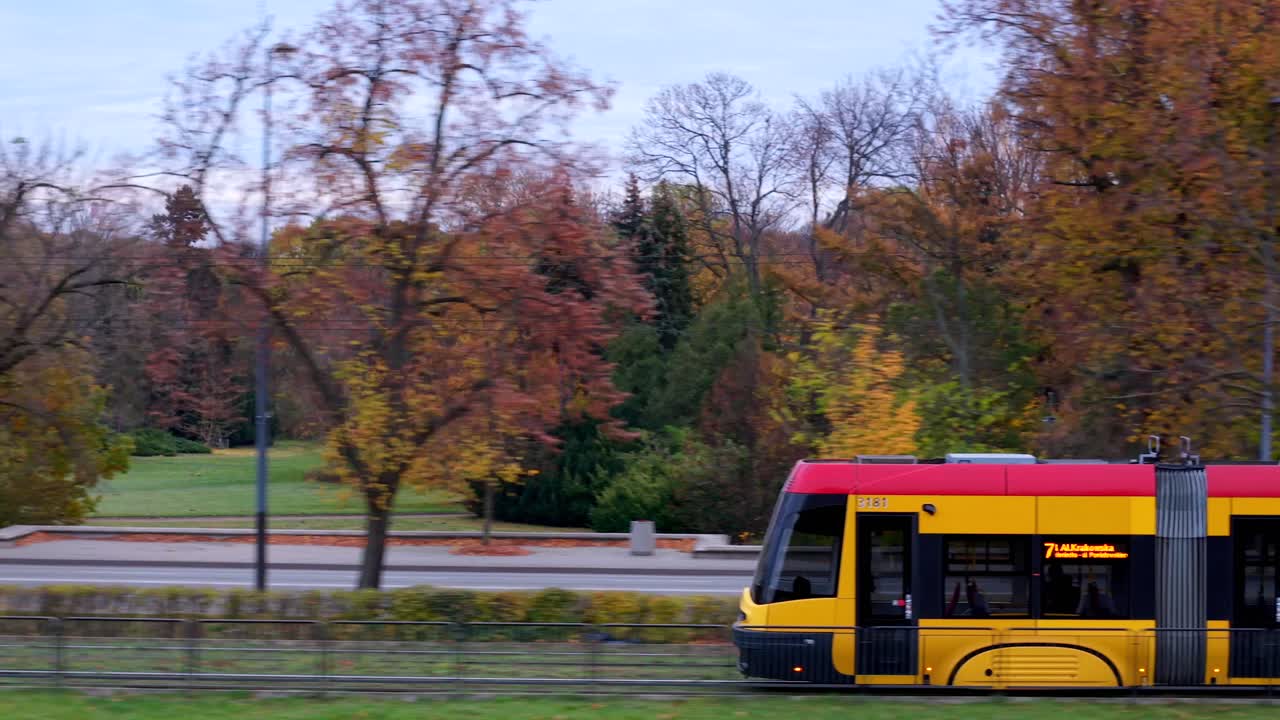 Yellow and Red Tram in Autumn