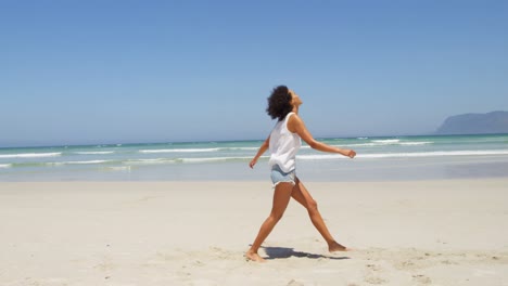 Woman-having-fun-at-beach-on-a-sunny-day-4k