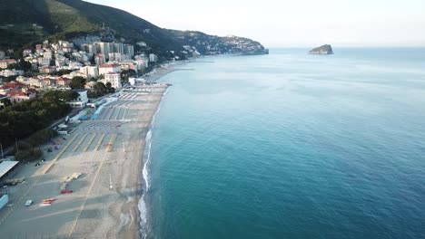 drone aerial shot of the italian shore with beaches, in genoa