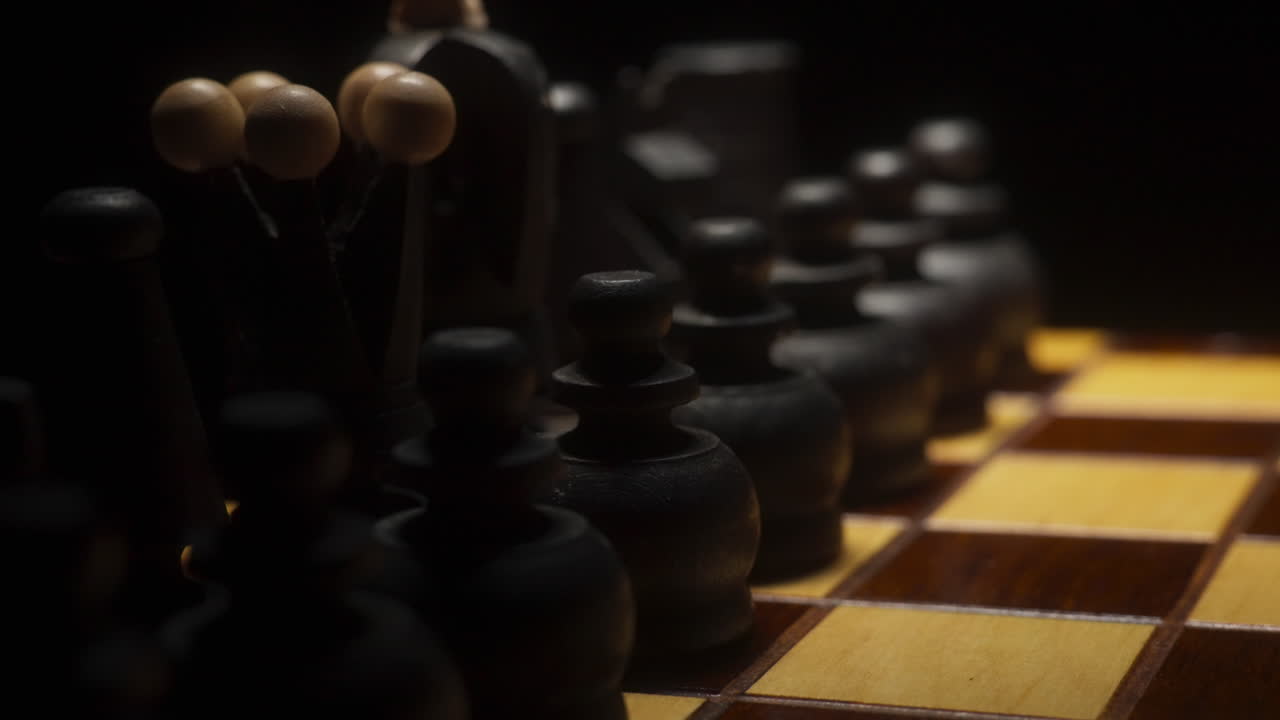Closeup of Black Chess Pieces on a Chessboard