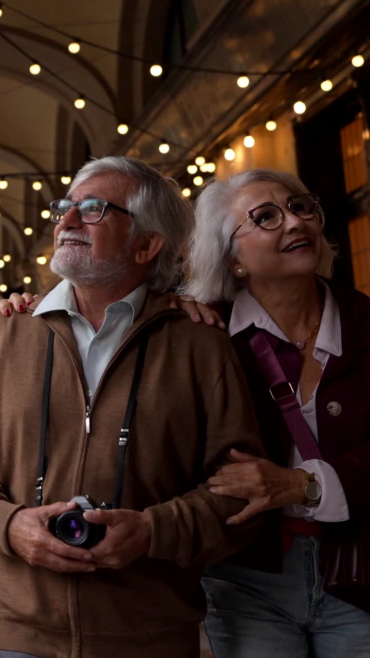 Older Adults Enjoying a Walk Through a City Arcade