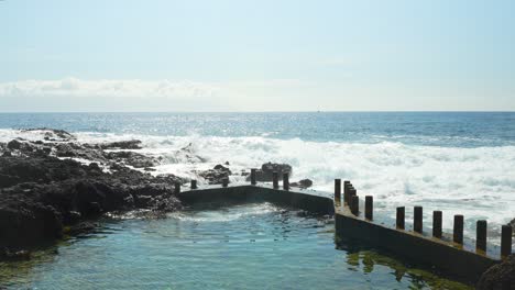 strong winds knocking up harbour at seaside alcala tenerife