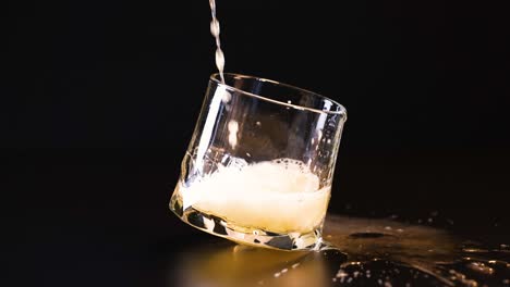 beer being poured into a tilted glass