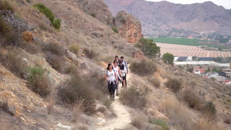 hikers group walk along a rout in the mountain