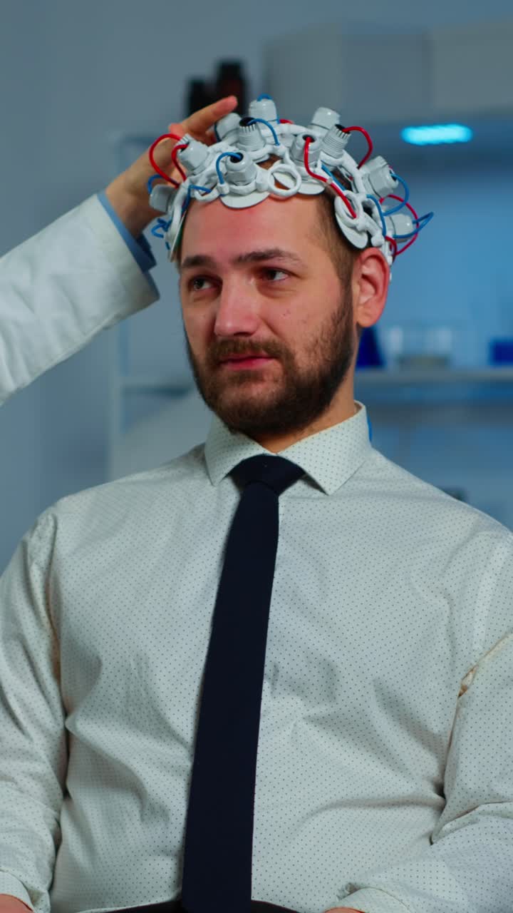 Man with EEG Cap Undergoing Brain Activity Test in a Lab